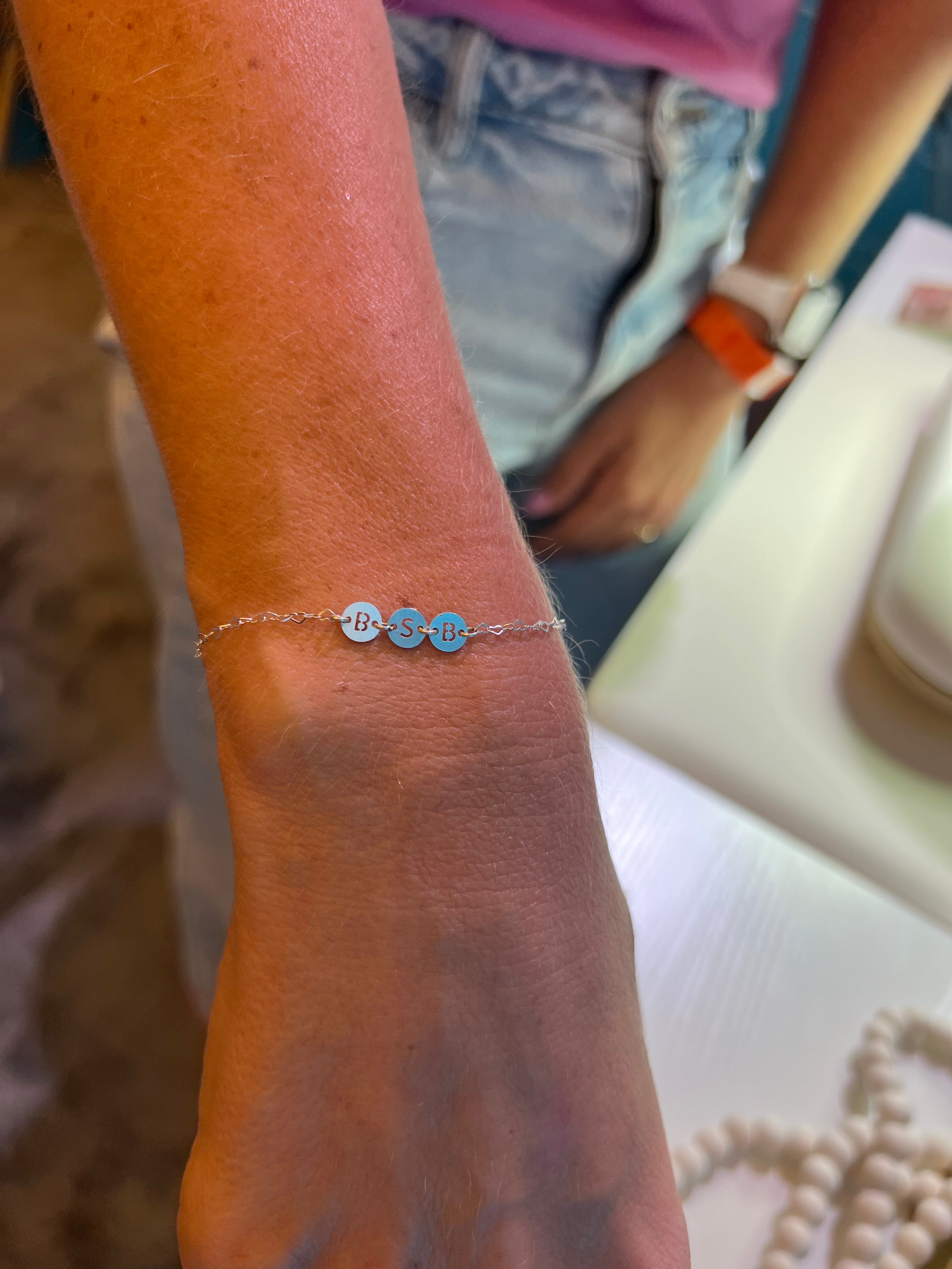 close up of a bsb charm bracelet 