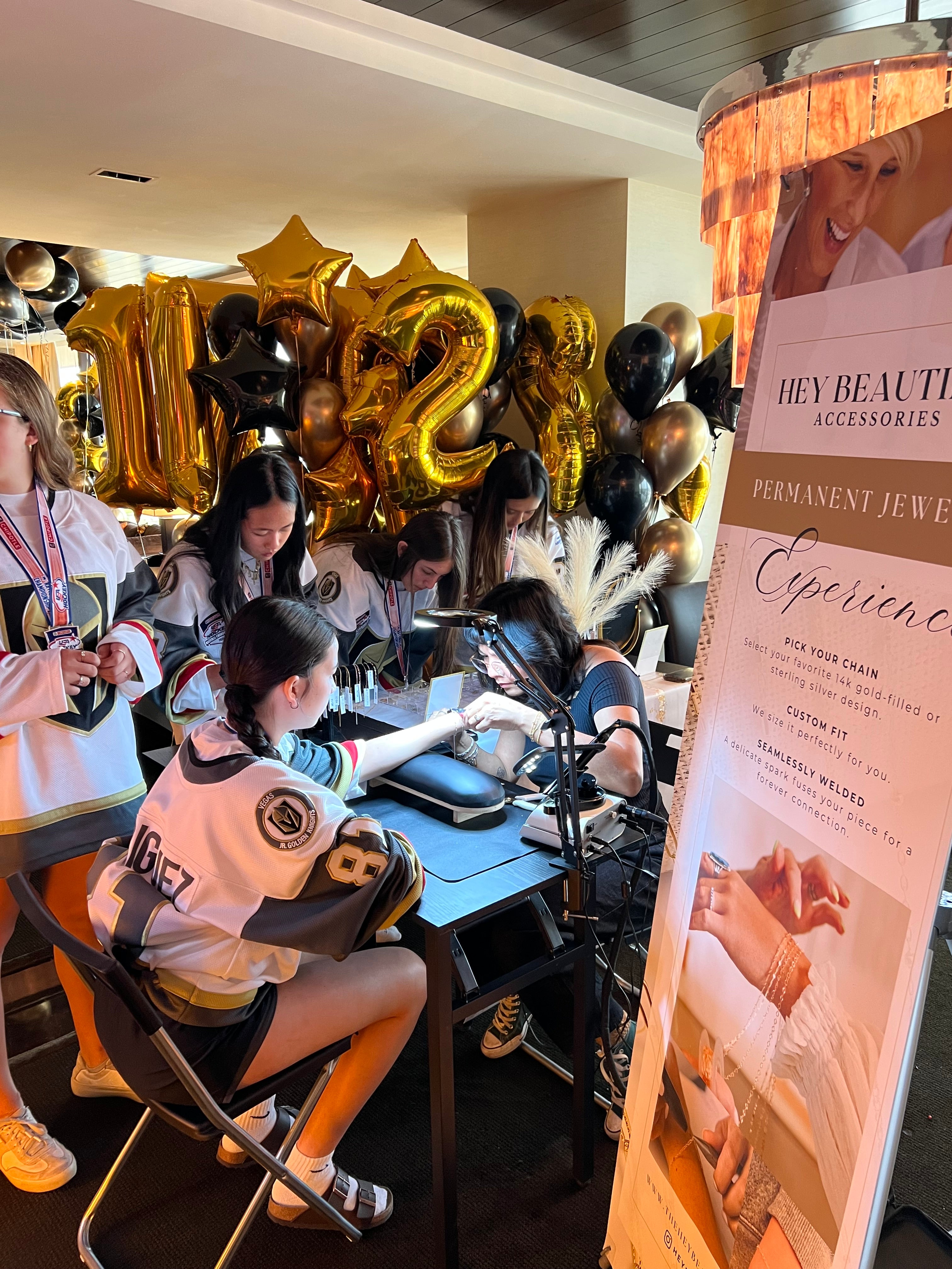 Hey Beautiful mobile permanent jewelry station setup for a private celebration party and local group event in Las Vegas.