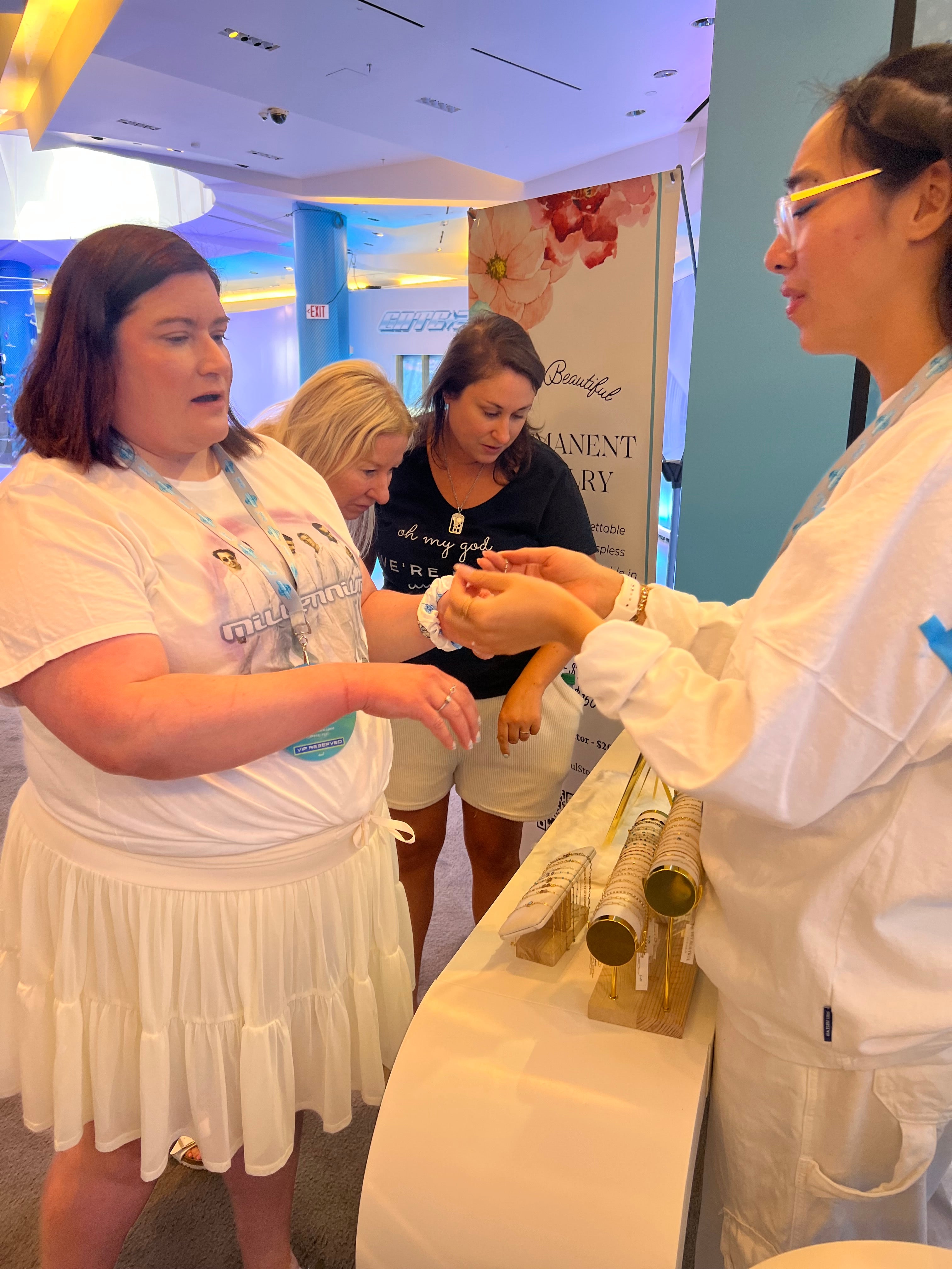 People interacting with a product display at an event
