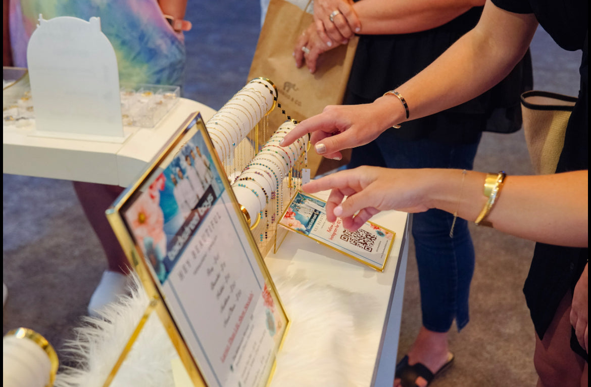Bracelet options displayed for fans at the Backstreet Boys activation