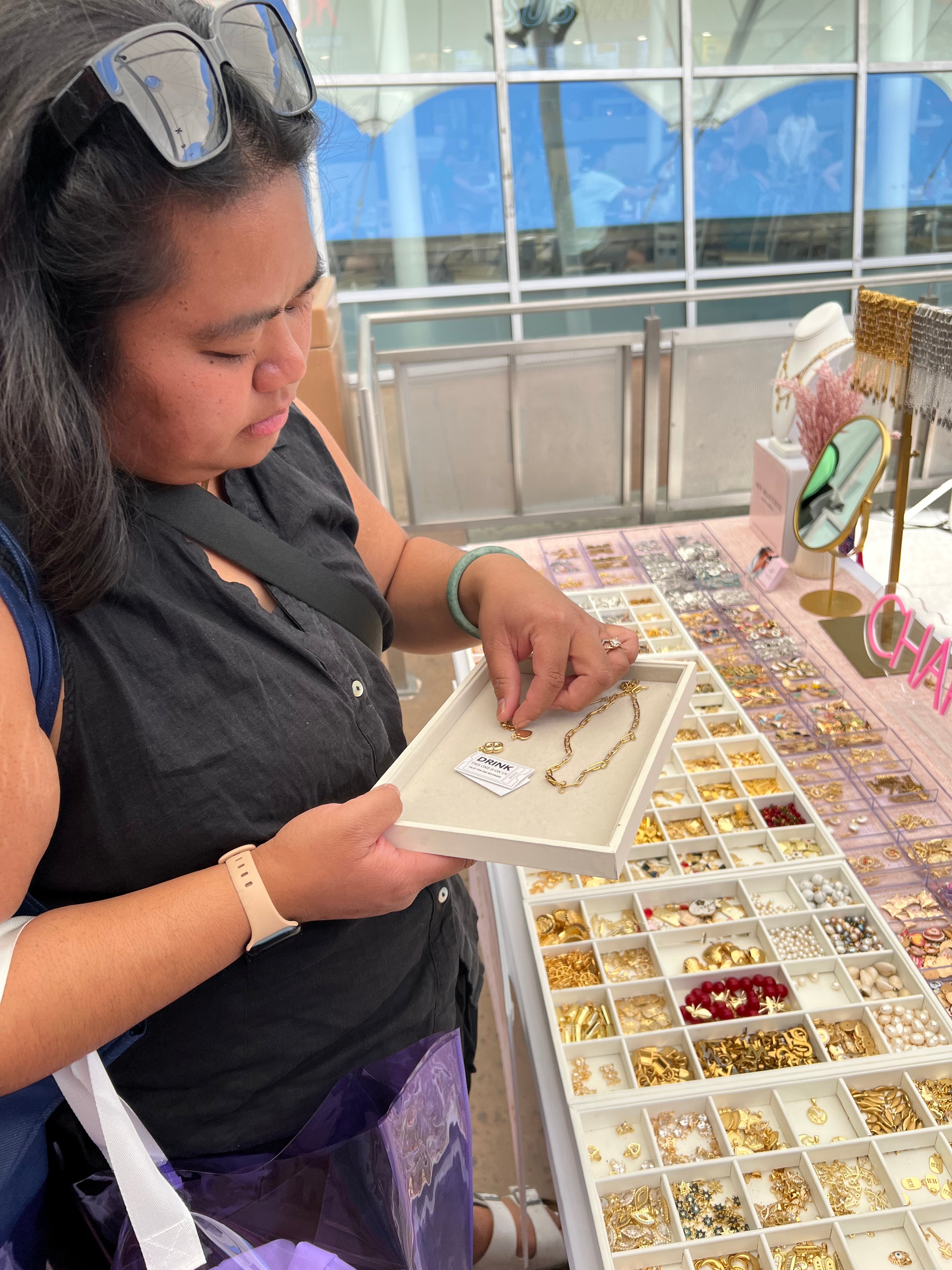 Guest selecting charms at a mobile charm bar activation