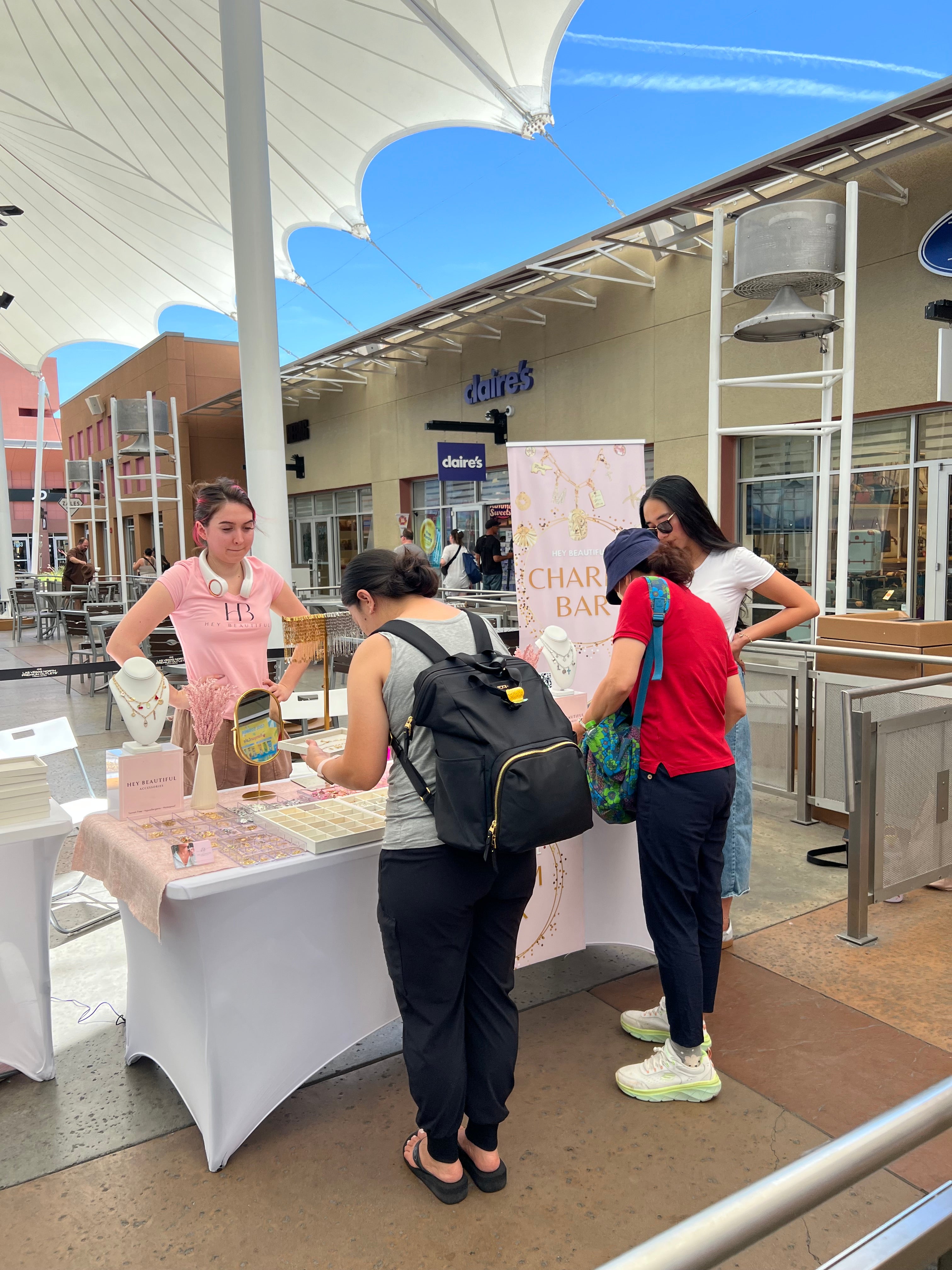 Guest selecting charms at a mobile charm bar activation.