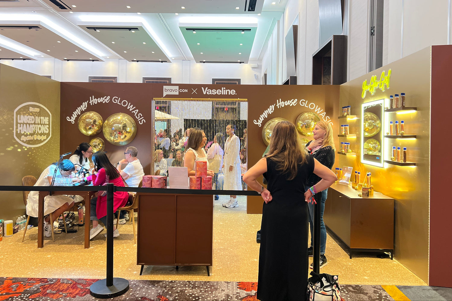 Permanent jewelry team providing on-site welding services for Vaseline at BravoCon